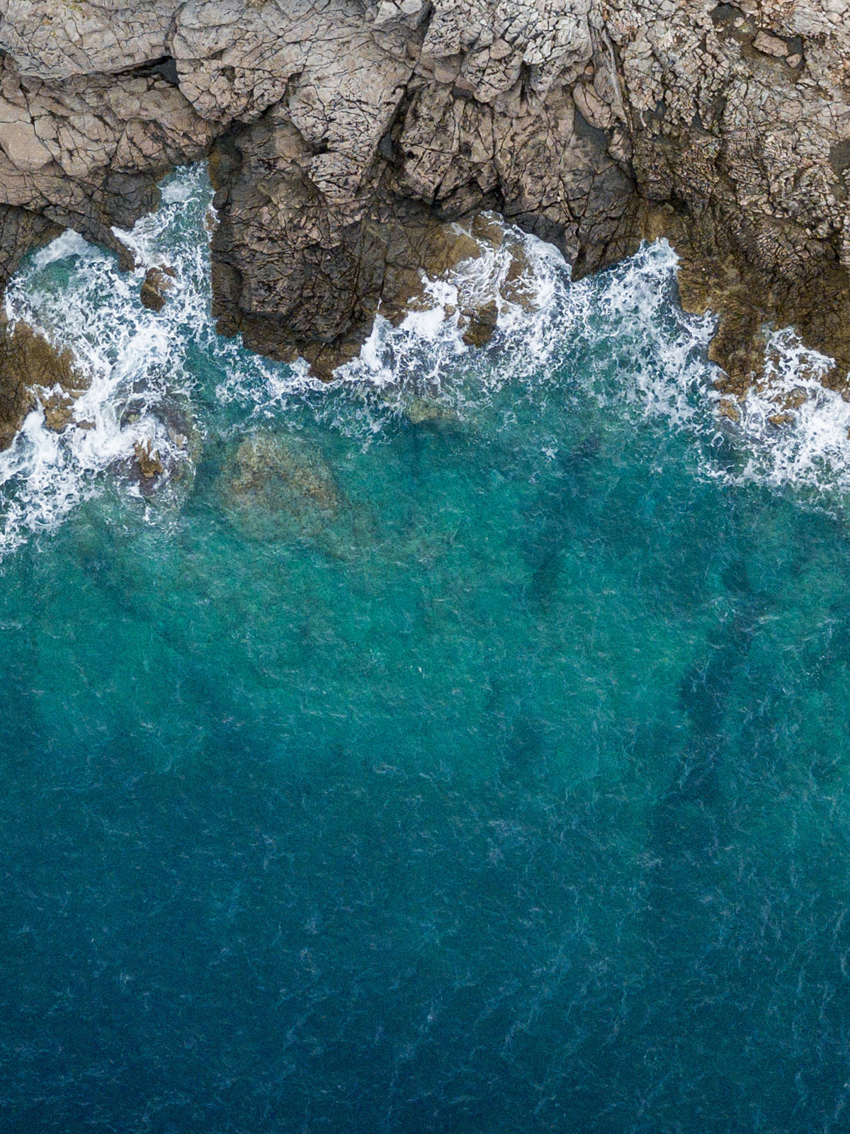 Aerial view of cliffs and beach.