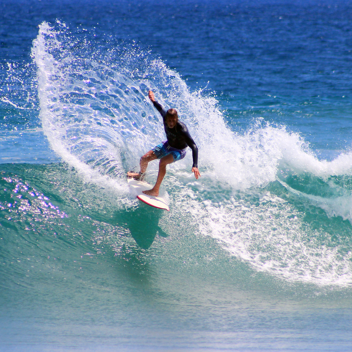 Surfer riding a big wave.